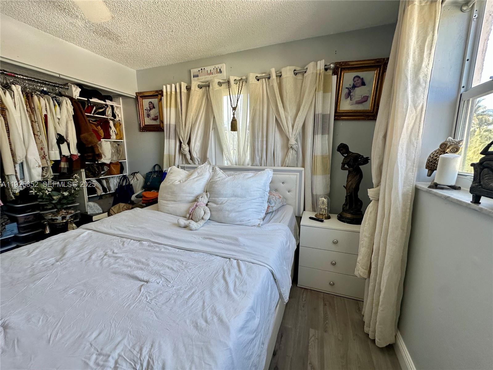 8091 Northwest 12th Street, Unit A Margate, FL 33063 - Photo 45 of 70 a bedroom with a bed and a walk in closet