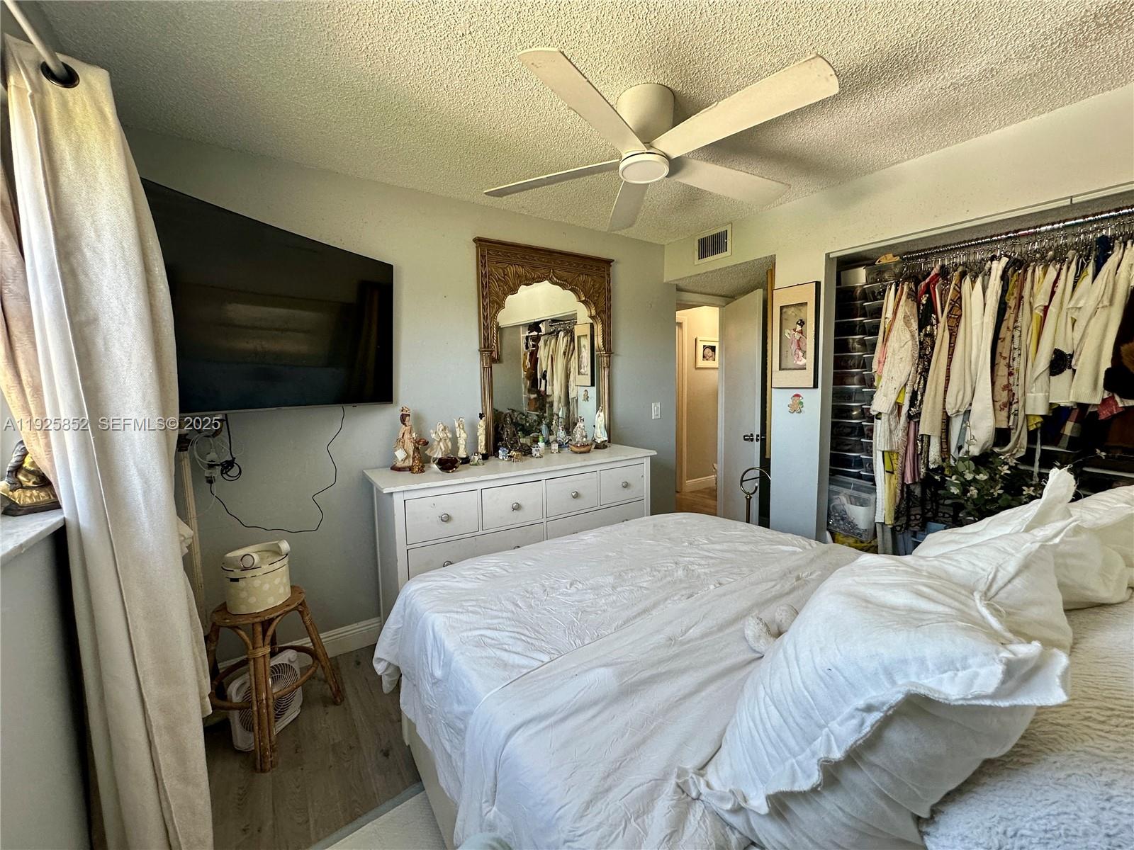 8091 Northwest 12th Street, Unit A Margate, FL 33063 - Photo 46 of 70 a bedroom with a bed window and a flat screen tv