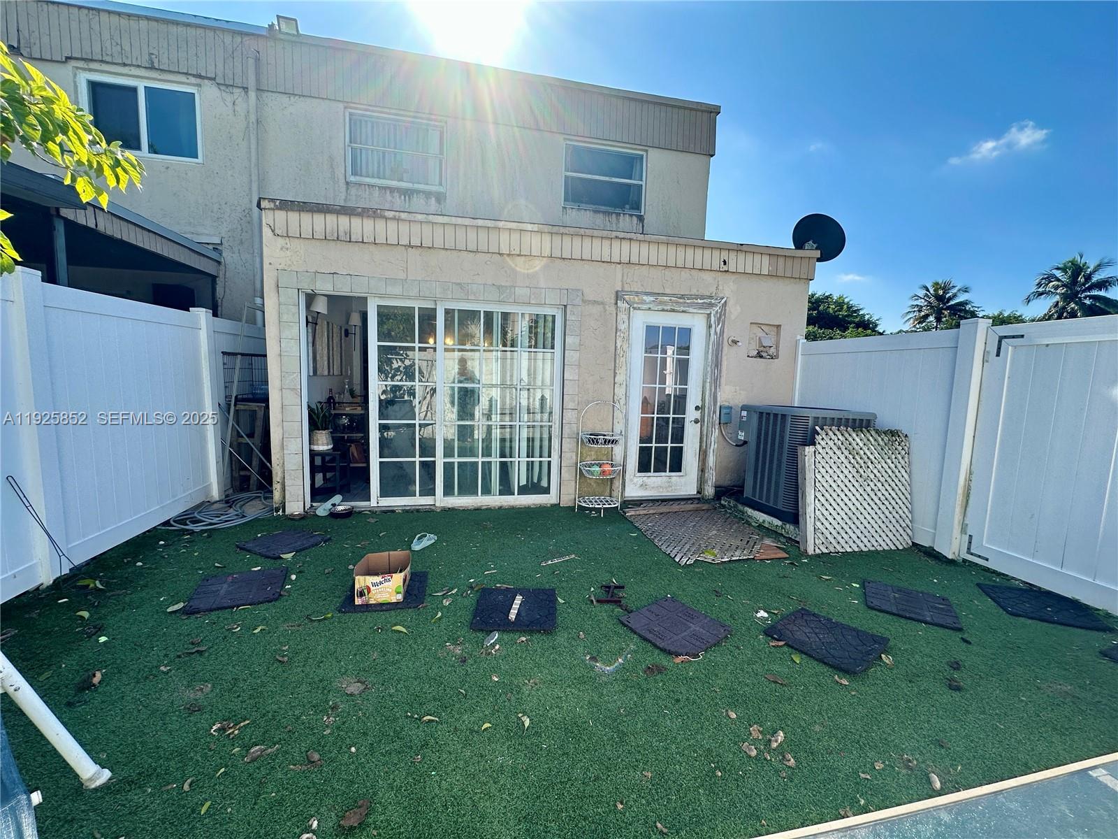 8091 Northwest 12th Street, Unit A Margate, FL 33063 - Photo 49 of 70 a view of a house with backyard sitting area and garden