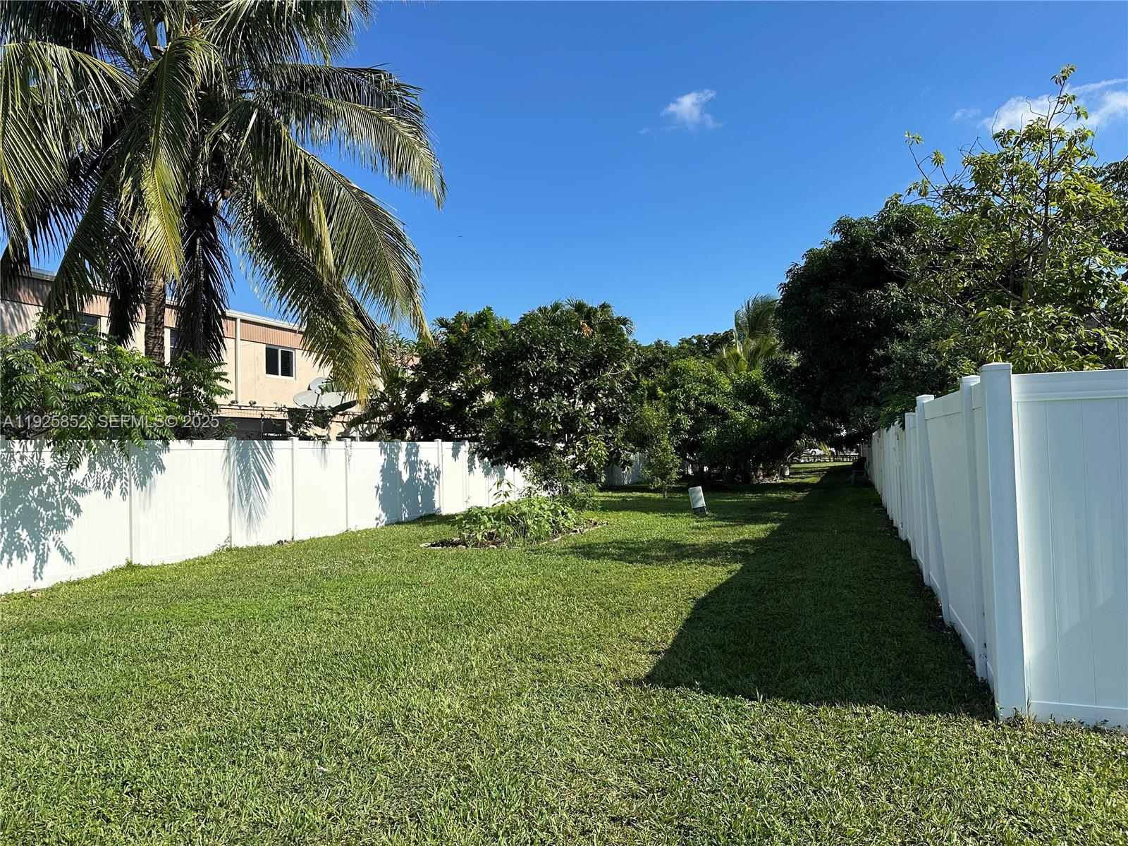 8091 Northwest 12th Street, Unit A Margate, FL 33063 - Photo 57 of 70 a backyard of a house with lots of green space
