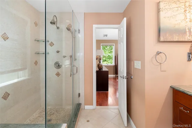 a bathroom with a shower and a sink