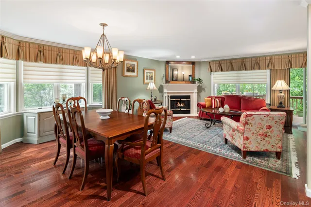 a living room with furniture a table and a fireplace