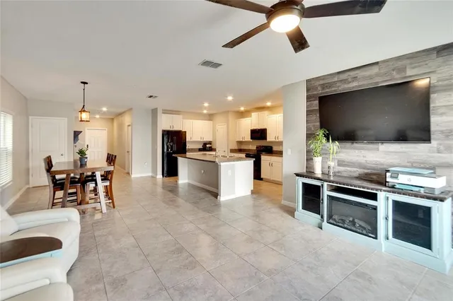 a bathroom with a granite countertop sink a mirror and a bathtub