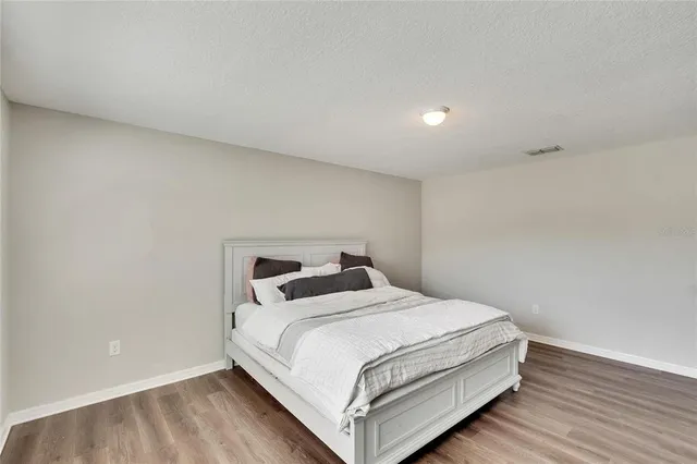 a view of walk in closet with clothes