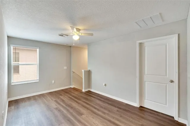 an aerial view of a house with a yard basket ball court and outdoor seating