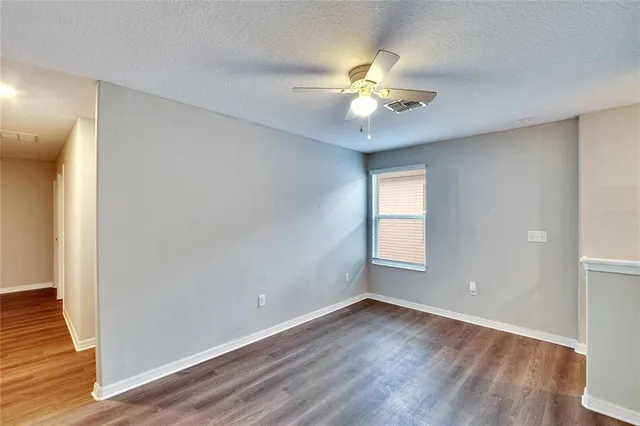 a view of a house with a lot of flower plants