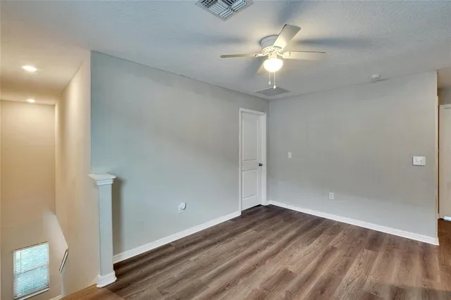 an aerial view of a house with a lake view