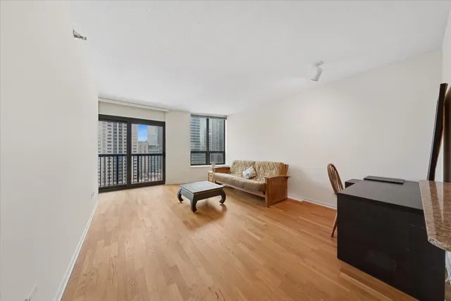a living room with furniture rug and window