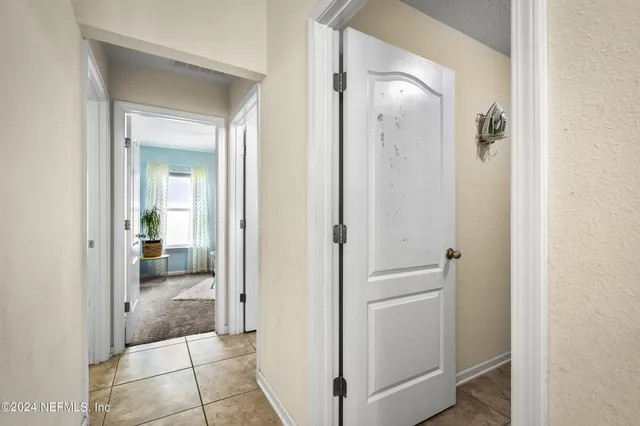 a bathroom with a glass shower door and mirror