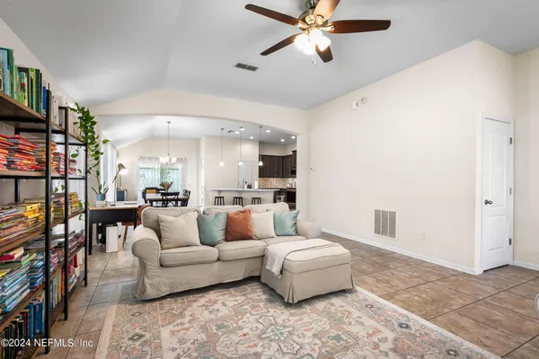a living room with furniture and a rug