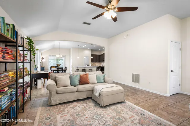 a living room with furniture and a rug