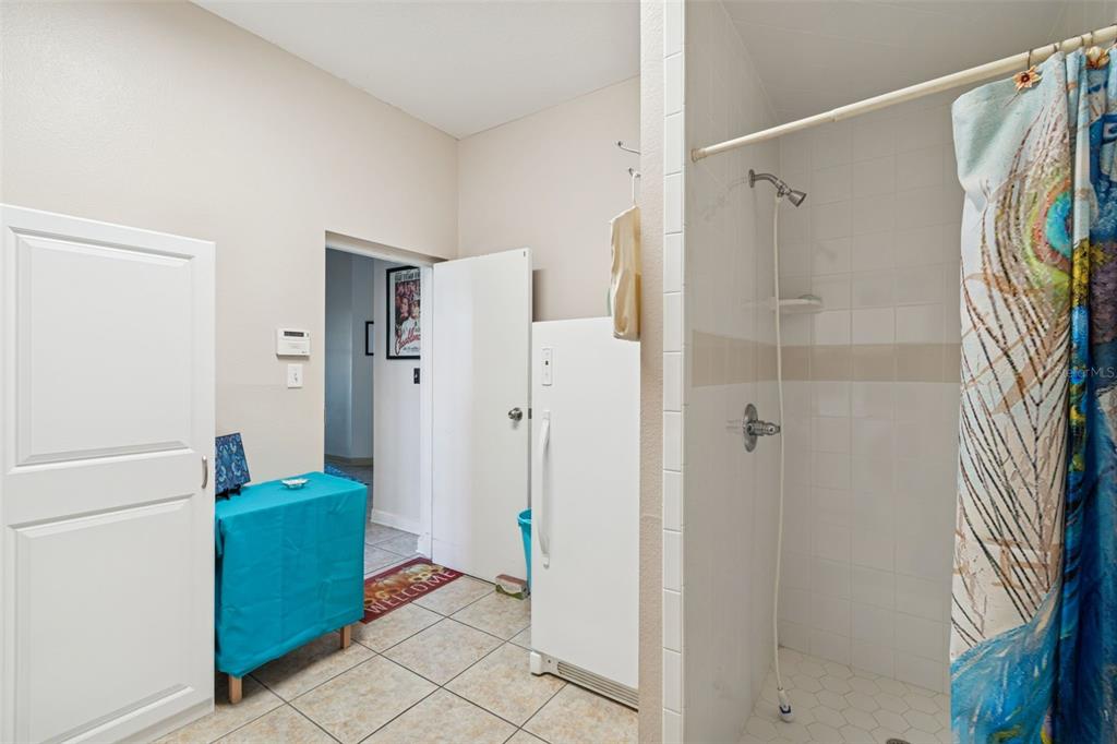 2307 Cass Road Lake Alfred, FL 33850 - Photo 14 of 67 a bathroom with a shower and a mirror
