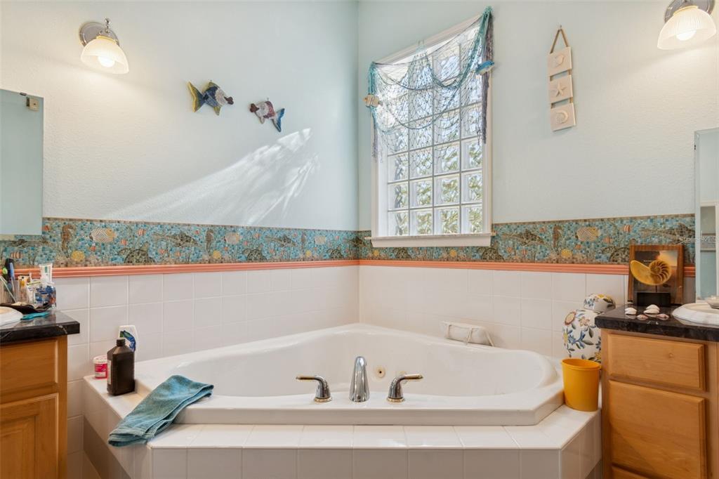 2307 Cass Road Lake Alfred, FL 33850 - Photo 24 of 67 a bathroom with a bathtub and a sink