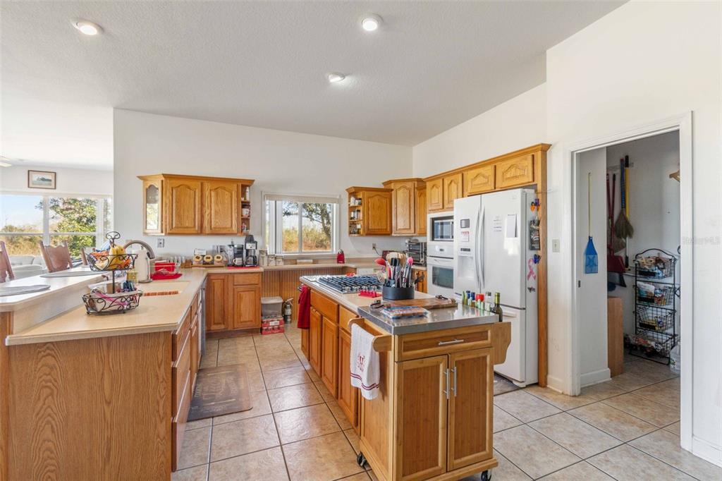 2307 Cass Road Lake Alfred, FL 33850 - Photo 26 of 67 a view of a kitchen with counter top space appliances and cabinets