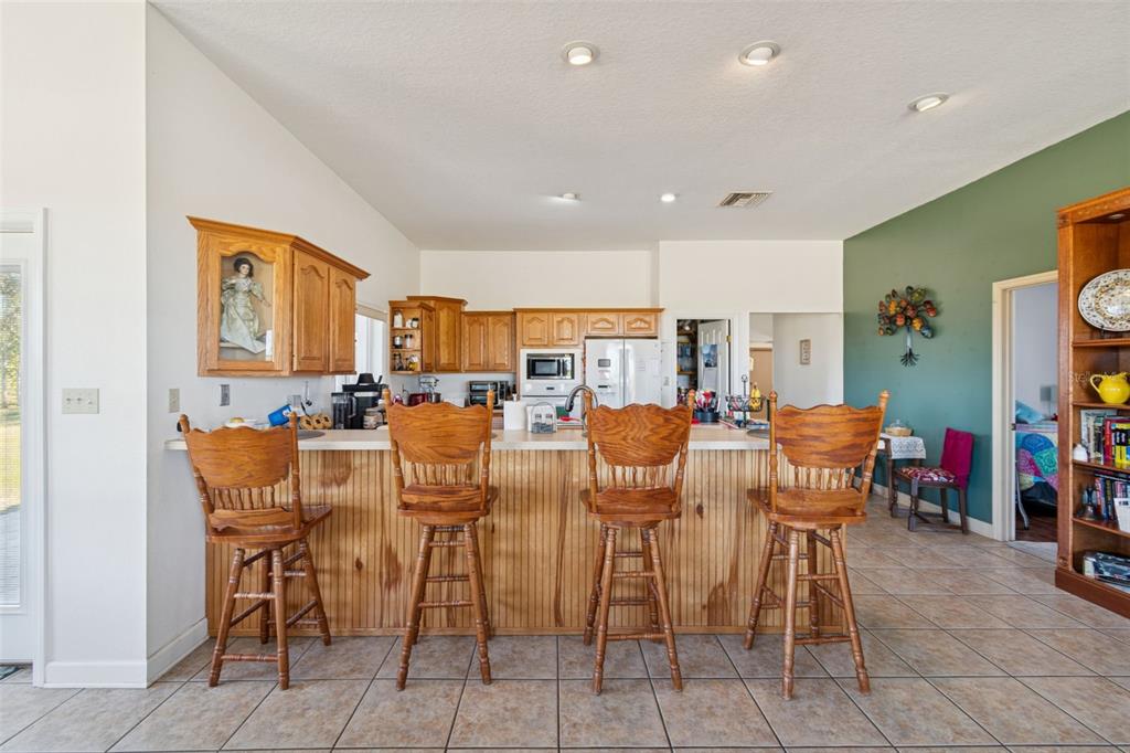 2307 Cass Road Lake Alfred, FL 33850 - Photo 29 of 67 a view of a dining area with furniture