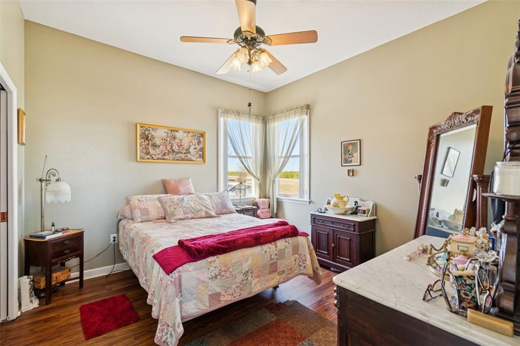 2307 Cass Road Lake Alfred, FL 33850 - Photo 36 of 67 a bedroom with a bed and a table in it