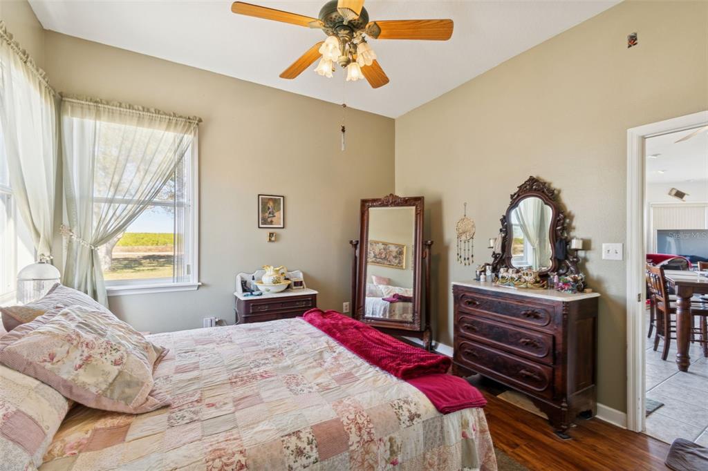 2307 Cass Road Lake Alfred, FL 33850 - Photo 37 of 67 a bedroom with a bed and a chandelier