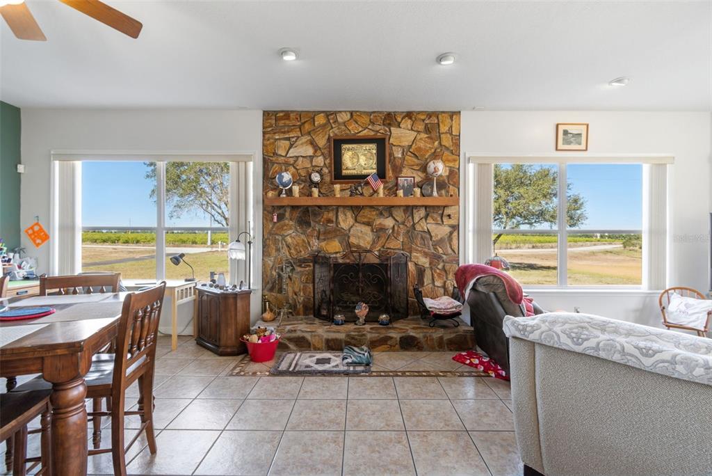 2307 Cass Road Lake Alfred, FL 33850 - Photo 42 of 67 a living room with furniture and a fireplace