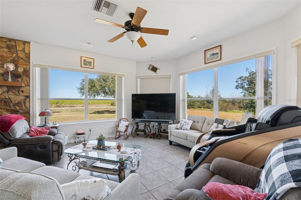 2307 Cass Road Lake Alfred, FL 33850 - Photo 45 of 67 a living room with furniture and a flat screen tv