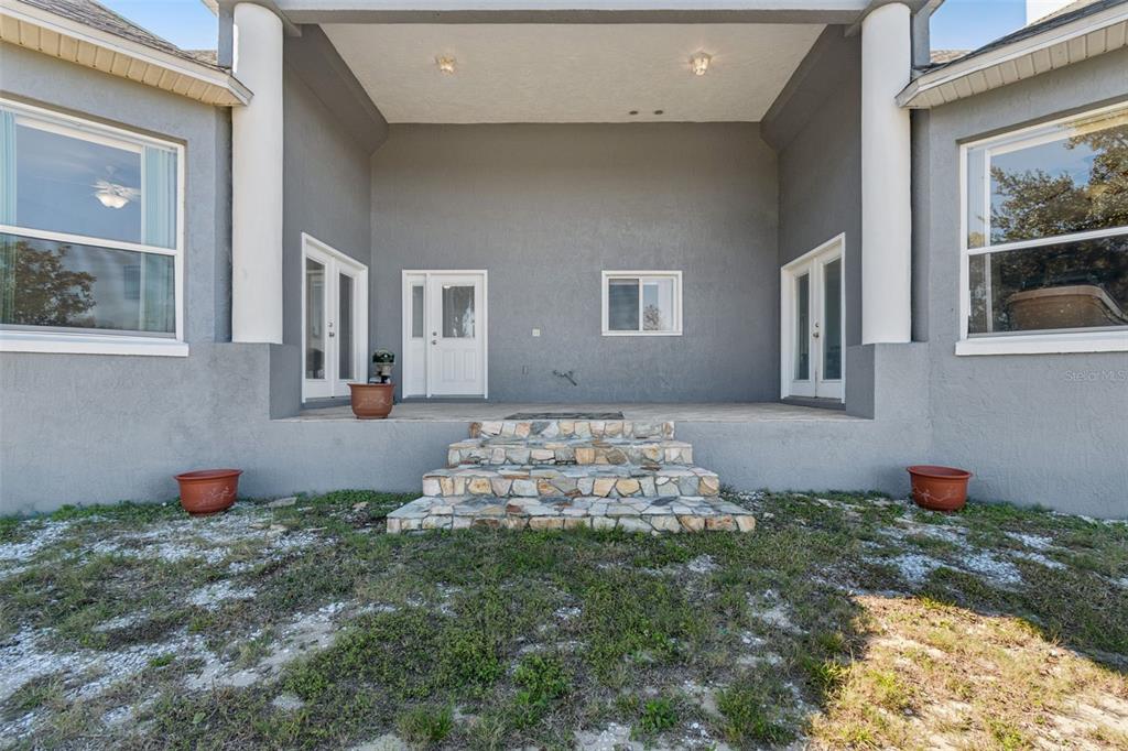 2307 Cass Road Lake Alfred, FL 33850 - Photo 5 of 67 a front view of a house with garden