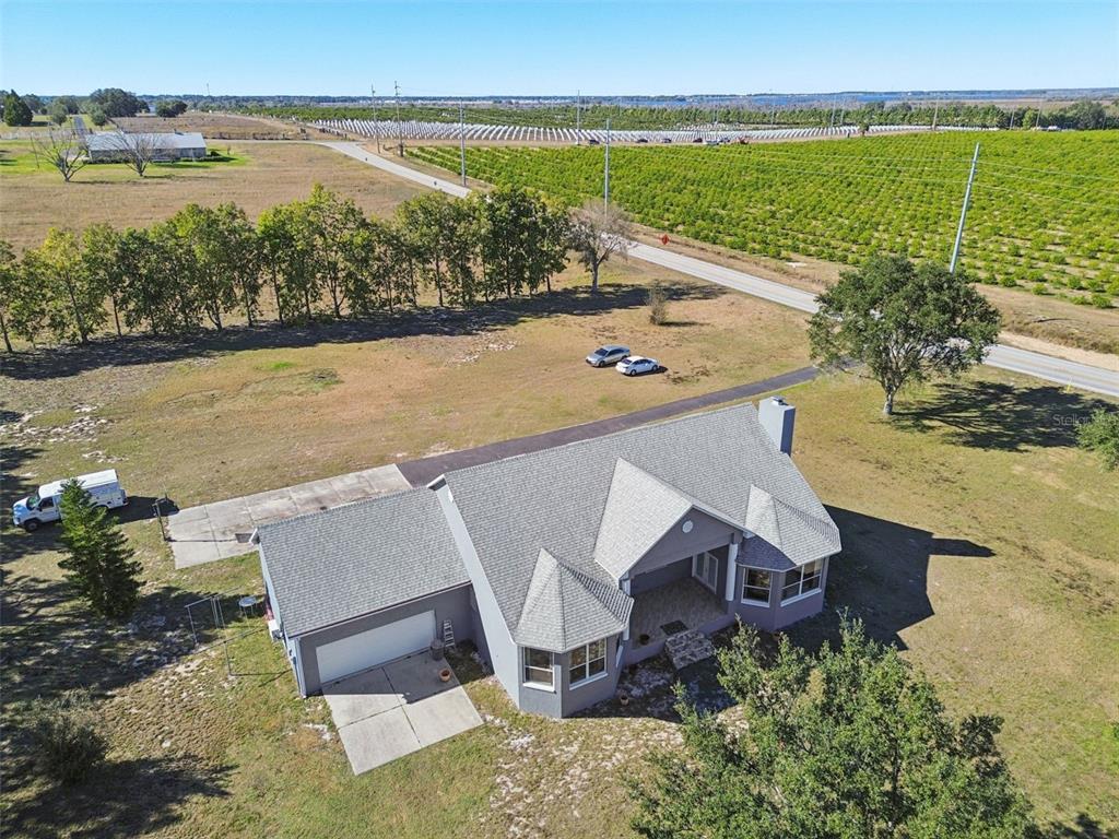 2307 Cass Road Lake Alfred, FL 33850 - Photo 52 of 67 an aerial view of ocean with residential house and outdoor space
