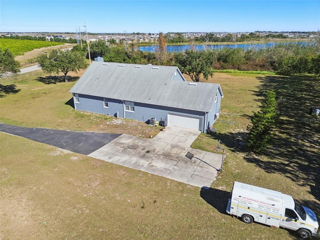 2307 Cass Road Lake Alfred, FL 33850 - Photo 58 of 67 an aerial view of a house with a yard and ocean view