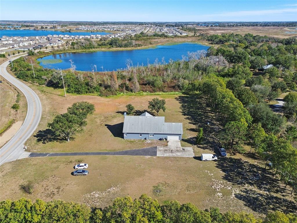 2307 Cass Road Lake Alfred, FL 33850 - Photo 60 of 67 an aerial view of a house with a lake view