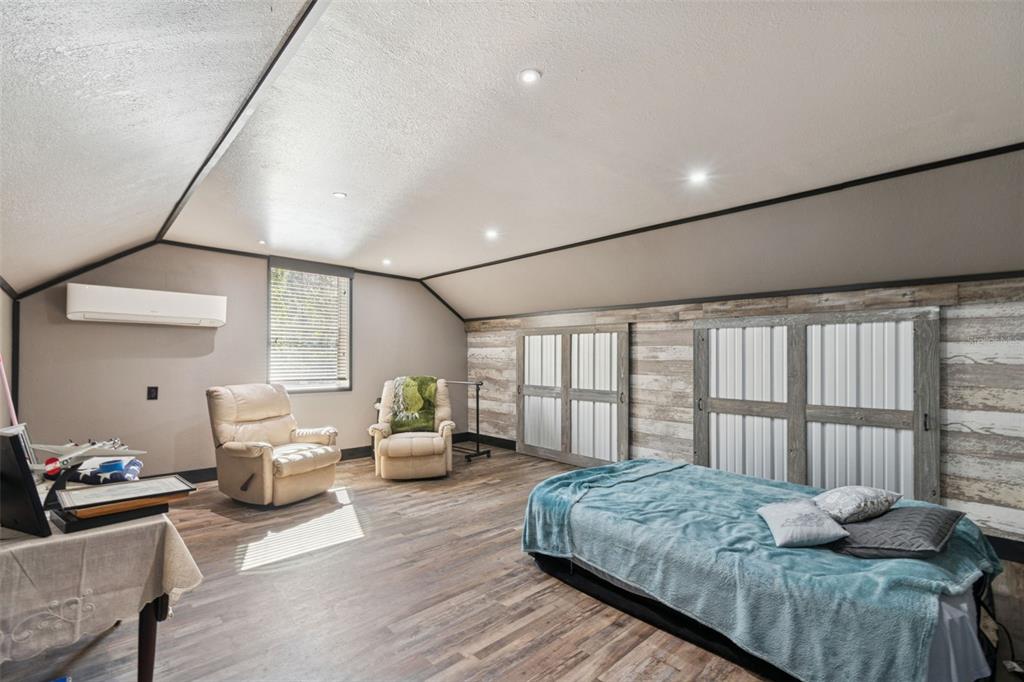 2307 Cass Road Lake Alfred, FL 33850 - Photo 8 of 67 a bedroom with furniture and a large window