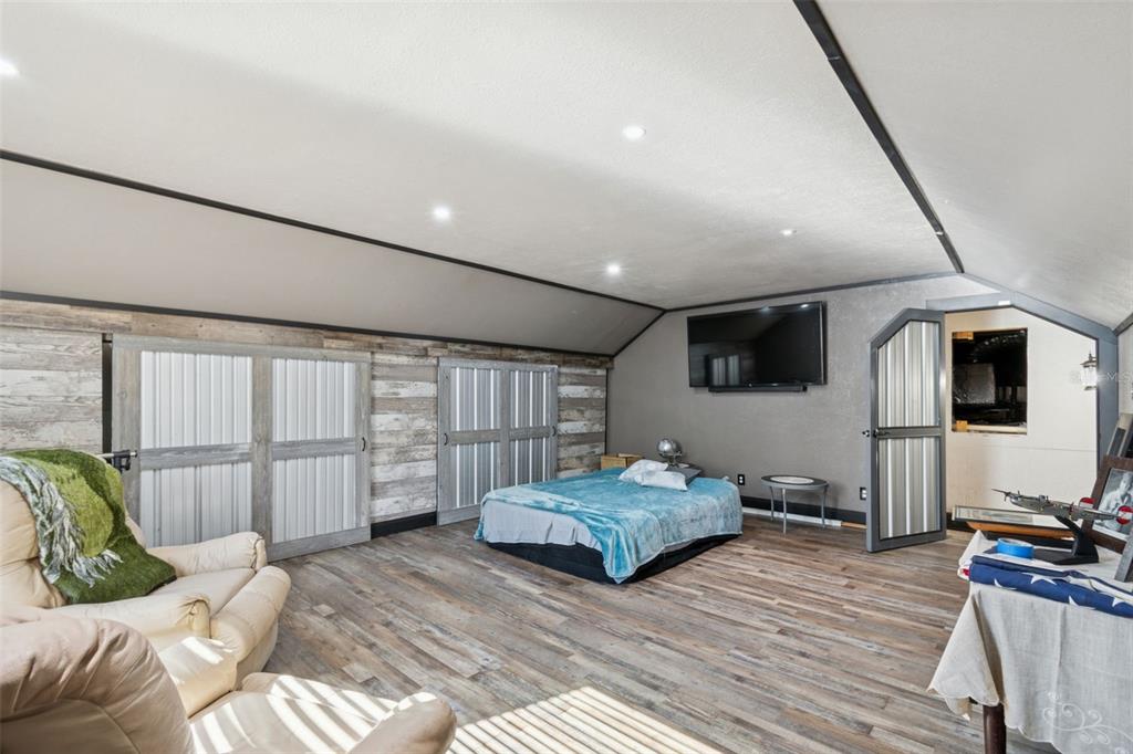 2307 Cass Road Lake Alfred, FL 33850 - Photo 9 of 67 a living room with furniture and a flat screen tv