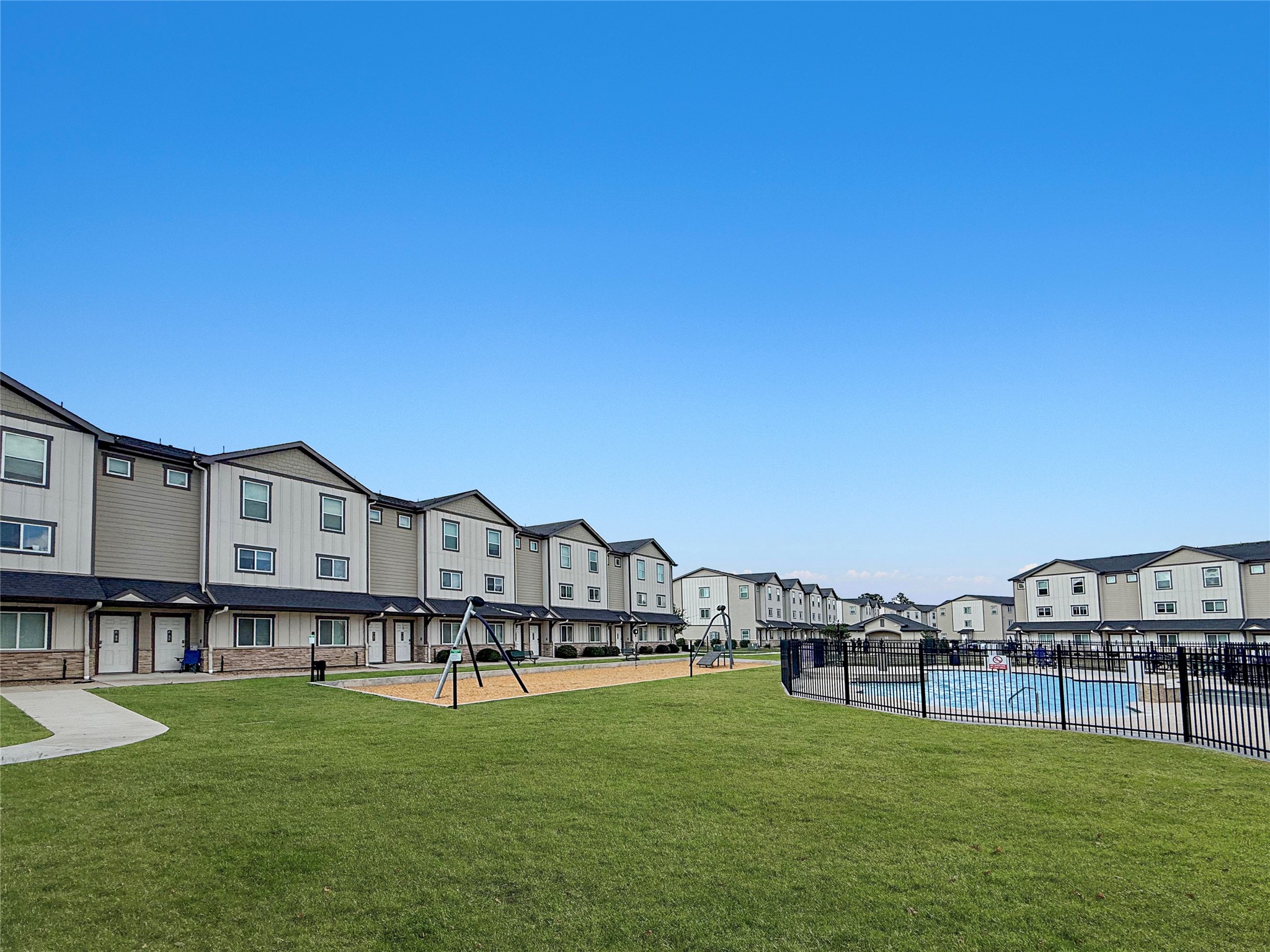 12603 Telge Road, Unit 8EH Cypress, TX 77429 - Photo 7 of 32 a view of a house with a big yard and a fountain