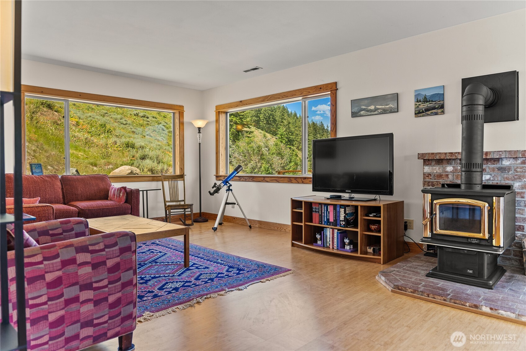 427 Rendezvous Road Winthrop, WA 98862 - Photo 15 of 40 a living room with furniture and a flat screen tv