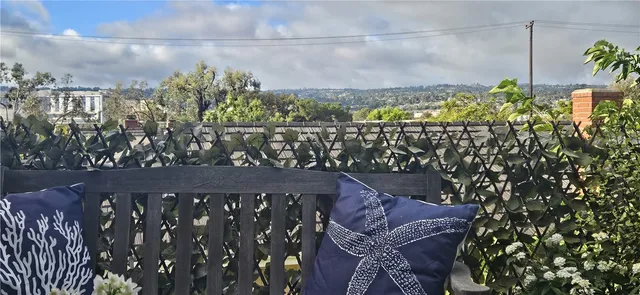 a outdoor sitting area with furniture and wooden floor