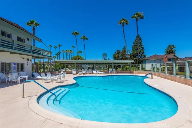 a room with pool table and windows