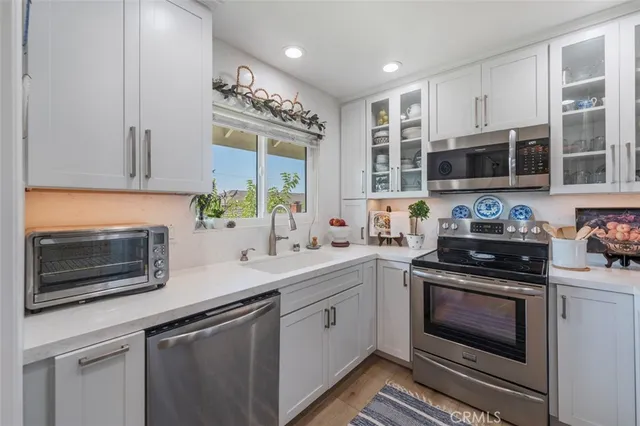 a living room with fireplace furniture and a fireplace