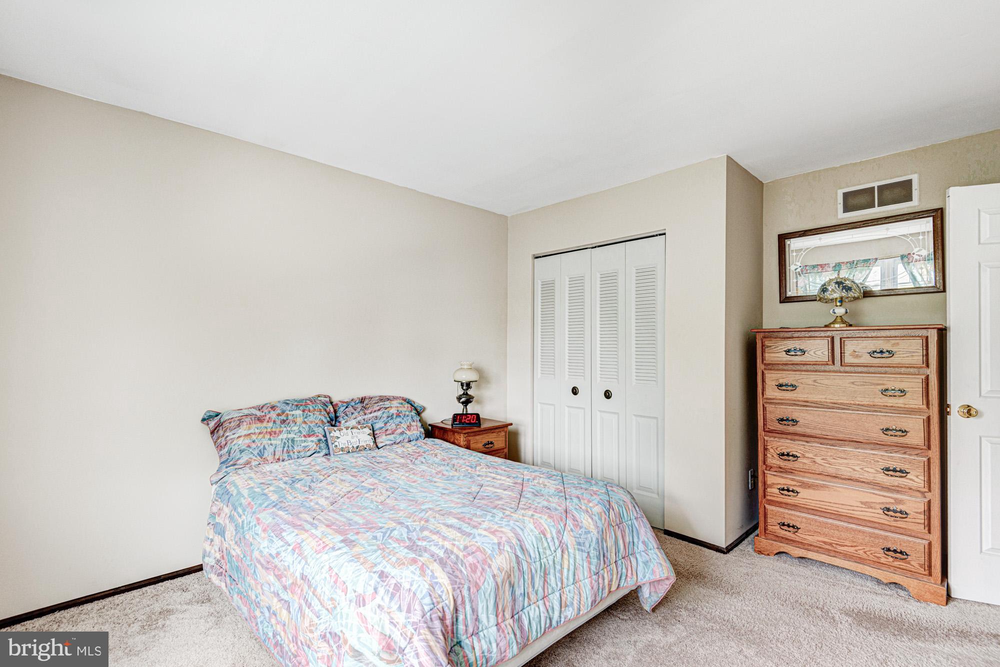 8 Risa Court Newark, DE 19702 - Photo 55 of 58 a bedroom with a bed and a closet