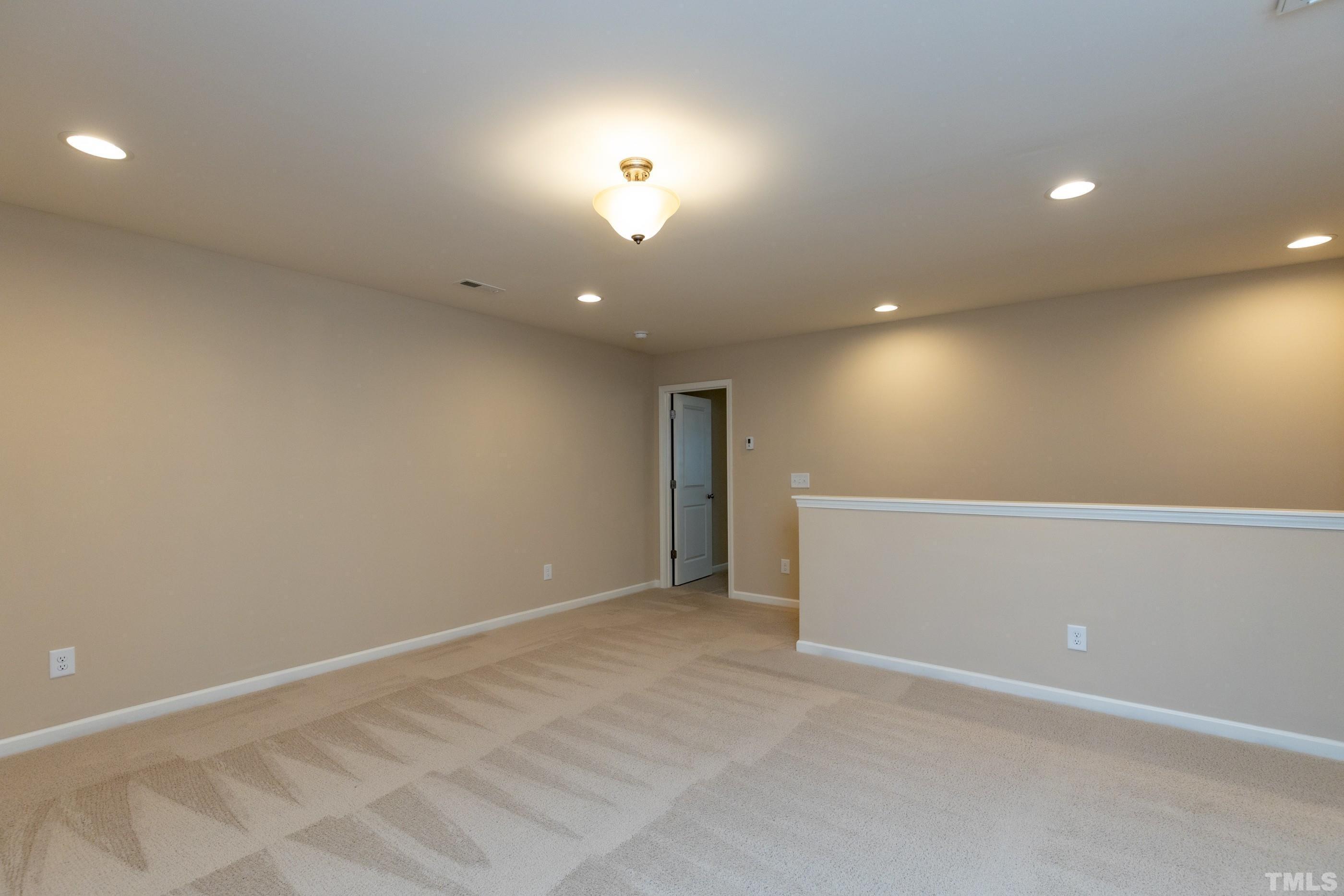 566 Chessie Station Apex, NC 27502 - Photo 15 of 29 a view of an empty room