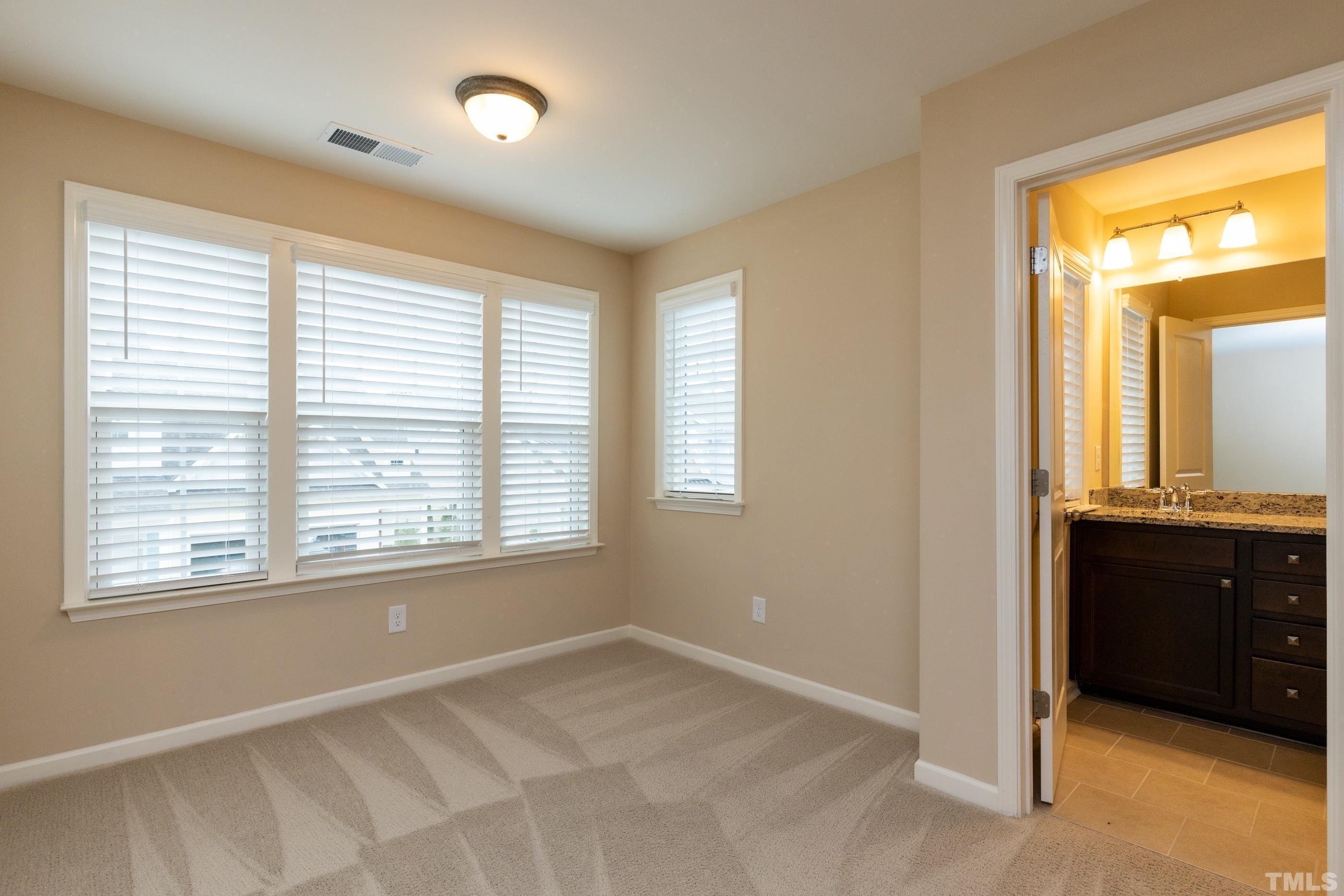 566 Chessie Station Apex, NC 27502 - Photo 18 of 29 a view of an empty room with a window