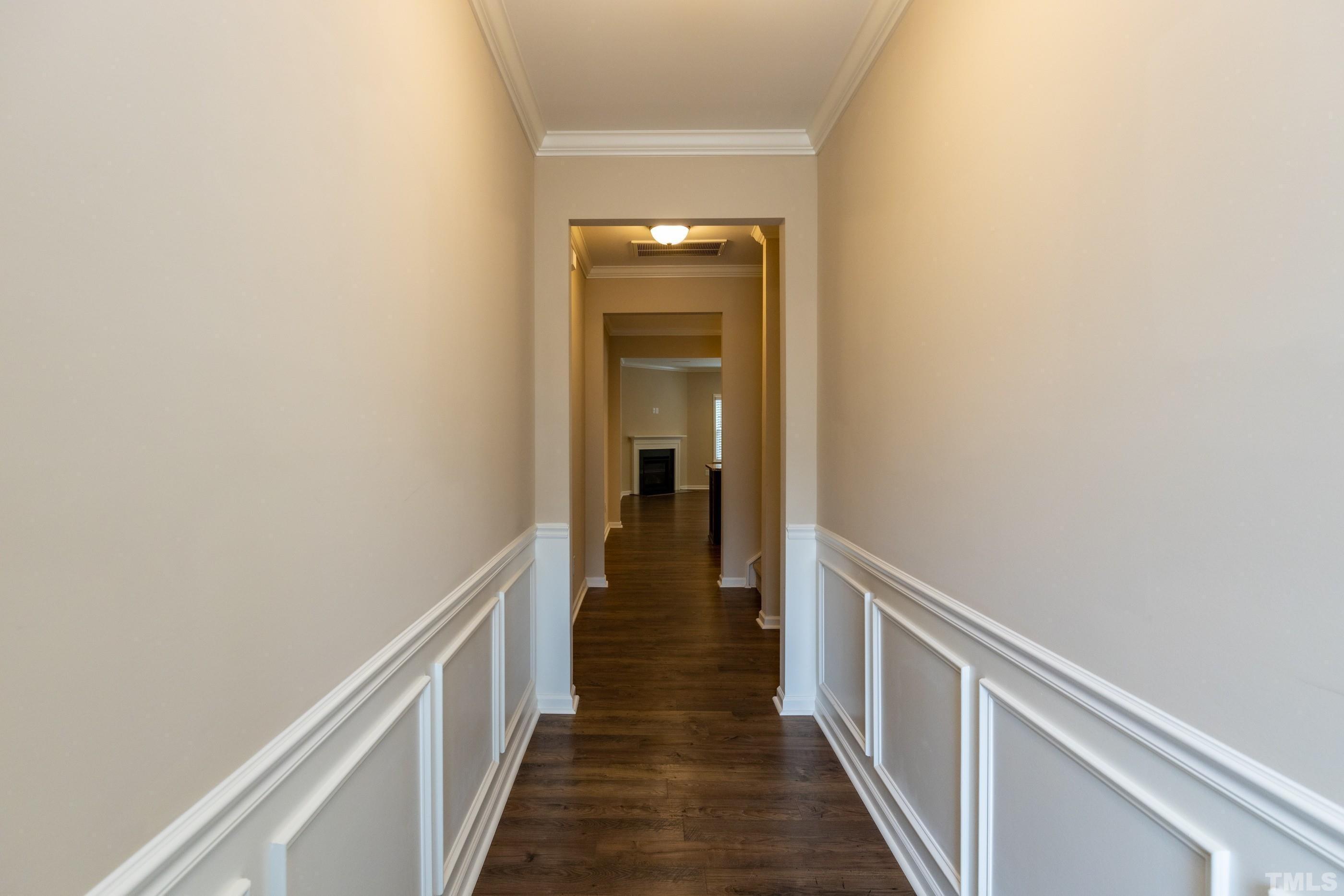 566 Chessie Station Apex, NC 27502 - Photo 2 of 29 a view of a hallway with wooden floor