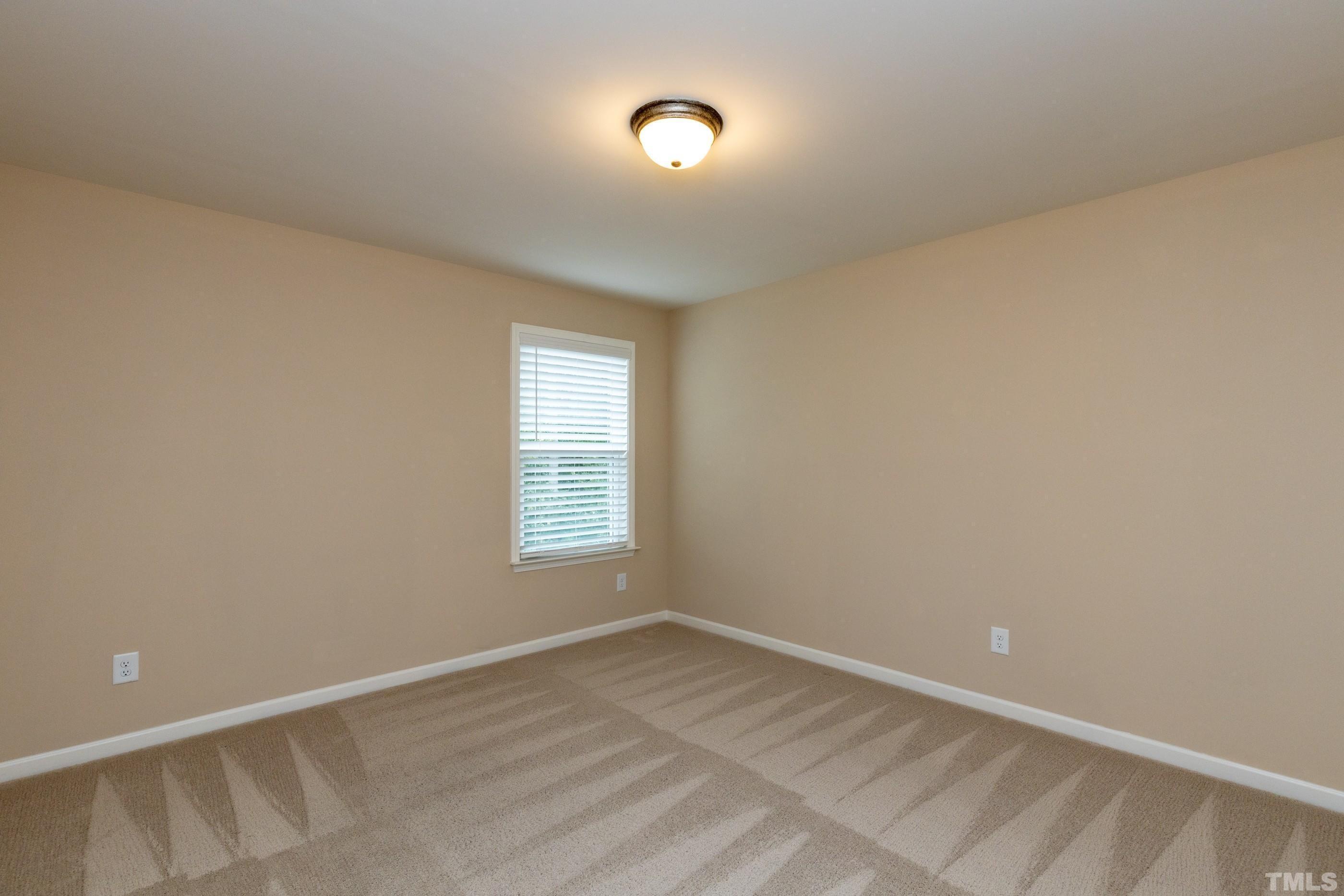 566 Chessie Station Apex, NC 27502 - Photo 23 of 29 a view of an empty room with a window
