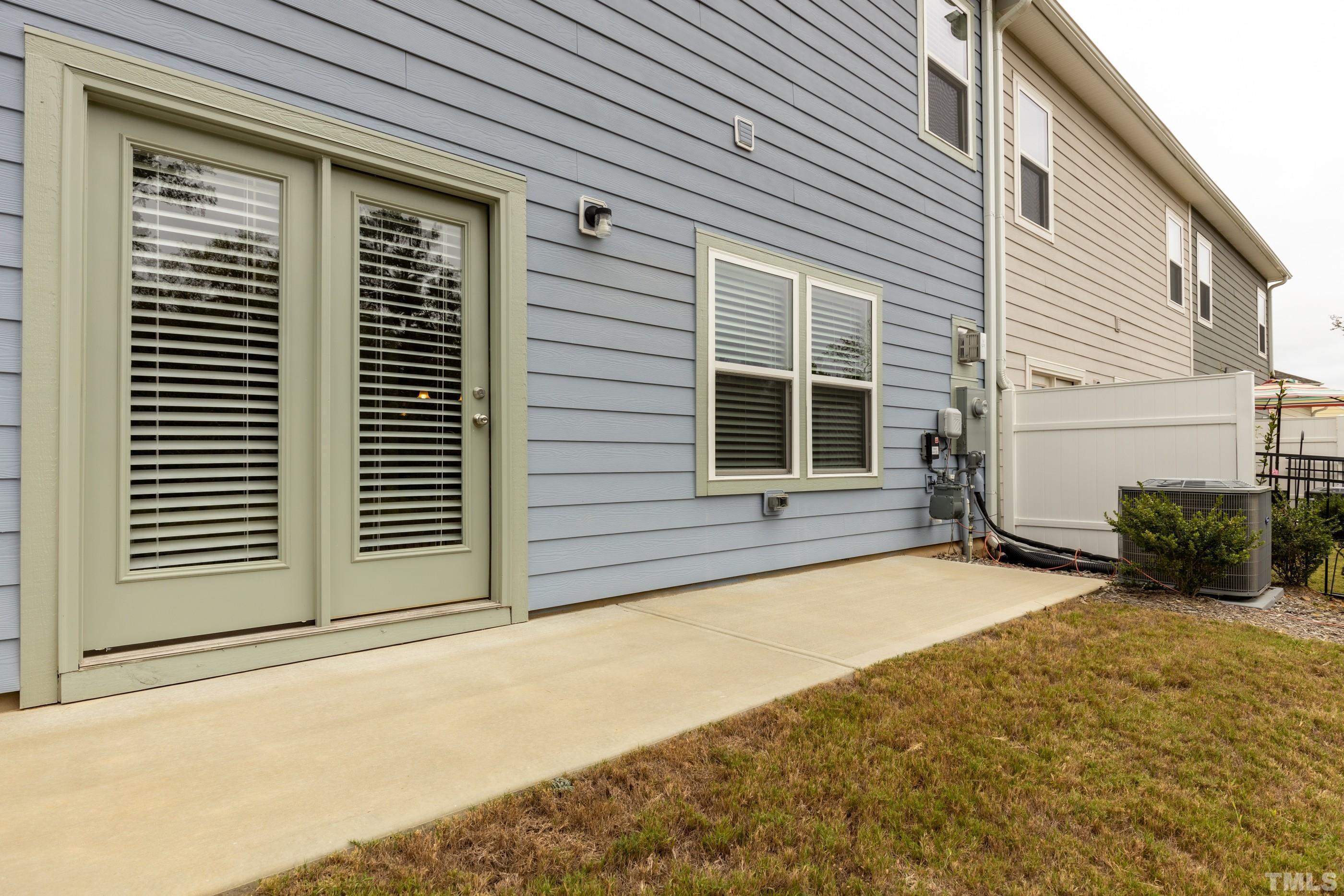 566 Chessie Station Apex, NC 27502 - Photo 28 of 29 a view of a house with more windows and plants
