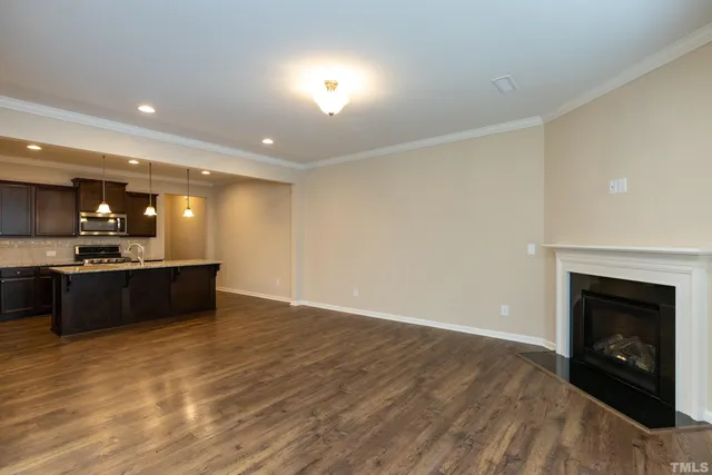 a large kitchen with a sink and a stove top oven