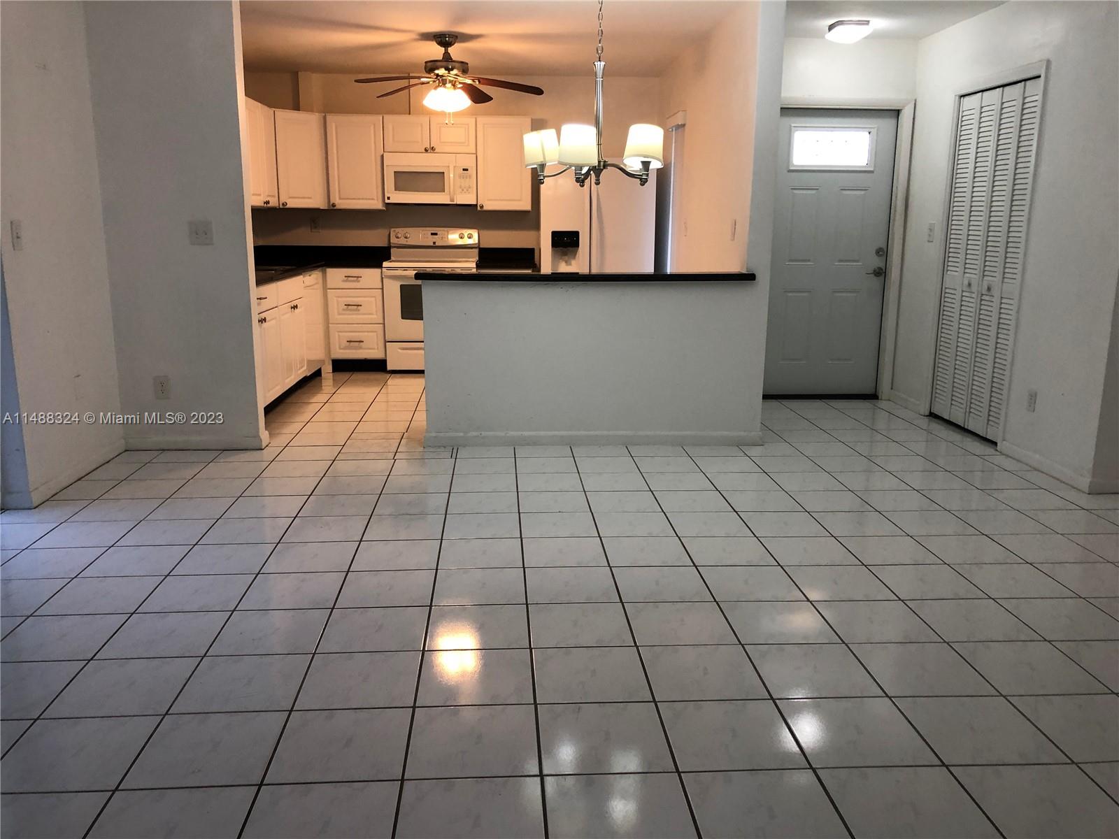 West Perrine Miami, FL 33157 - Photo 6 of 15 a kitchen with stainless steel appliances a sink and cabinets