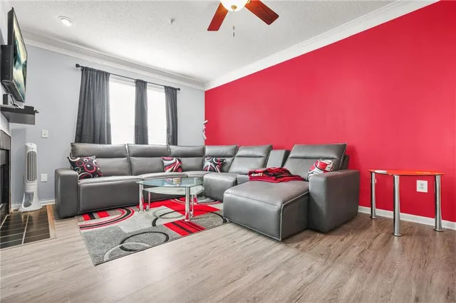 a living room with furniture and a flat screen tv