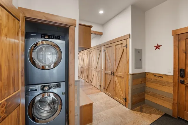 a view of a storage and utility room with dryer and washer