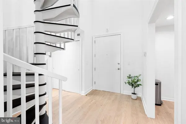 a view of entryway with wooden floor