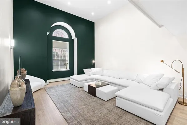a living room with furniture and window