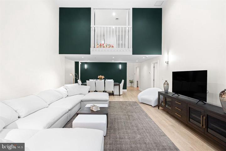 211 South 4th Street, Unit 104 Philadelphia, PA 19106 - Photo 20 of 45 a living room with furniture and a flat screen tv