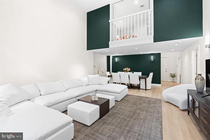 211 South 4th Street, Unit 104 Philadelphia, PA 19106 - Photo 21 of 45 a living room with furniture white walls and a fireplace