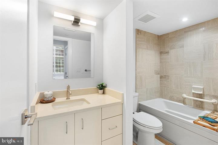 211 South 4th Street, Unit 104 Philadelphia, PA 19106 - Photo 26 of 45 a bathroom with a sink toilet vanity tub and shower