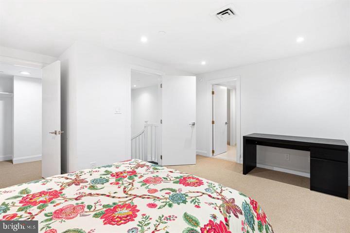 211 South 4th Street, Unit 104 Philadelphia, PA 19106 - Photo 28 of 45 a bedroom with a bed and a dresser